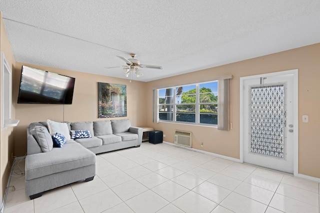 189 Prescott J 189, Deerfield Beach, FL 33442 - living room featuring ceiling fan, a textured ceiling, baseboards, a wall unit AC, and light tile patterned floors