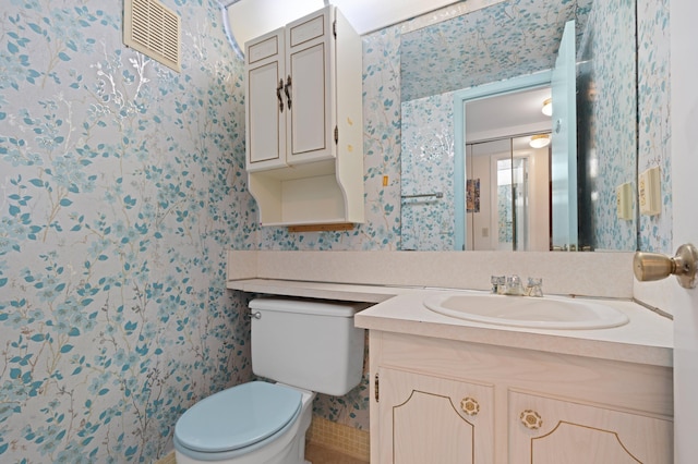 189 Prescott J 189, Deerfield Beach, FL 33442 - half bathroom with wallpapered walls, vanity, and toilet