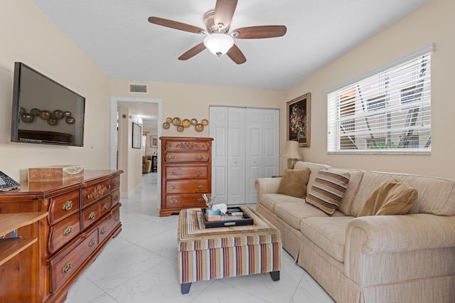 213 Piedmont E, Delray Beach, FL 33484 - living room with light marble finish floors and a ceiling fan