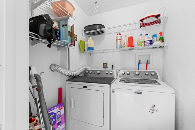 213 Piedmont E, Delray Beach, FL 33484 - laundry area with washing machine and clothes dryer