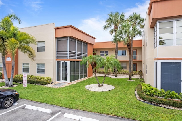 213 Piedmont E, Delray Beach, FL 33484 - view of building exterior featuring uncovered parking