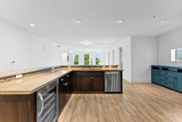 455 E Palmetto Park Rd Unit 3E, Boca Raton, FL 33432 - kitchen with stainless steel dishwasher, wine cooler, a sink, light wood-style flooring, and dark brown cabinetry