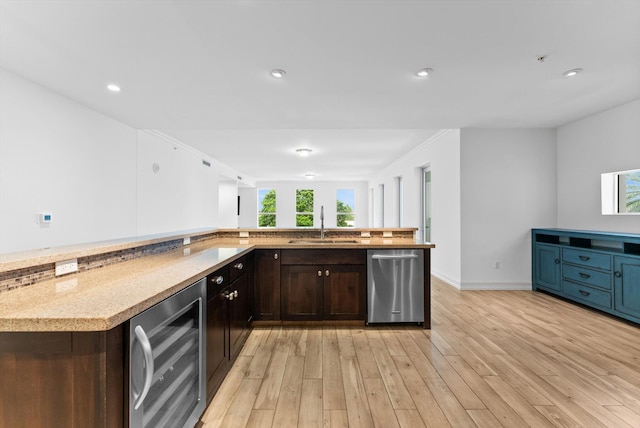 455 E Palmetto Park Rd Unit 3E, Boca Raton, FL 33432 - kitchen with stainless steel dishwasher, wine cooler, a sink, light wood-style flooring, and dark brown cabinetry