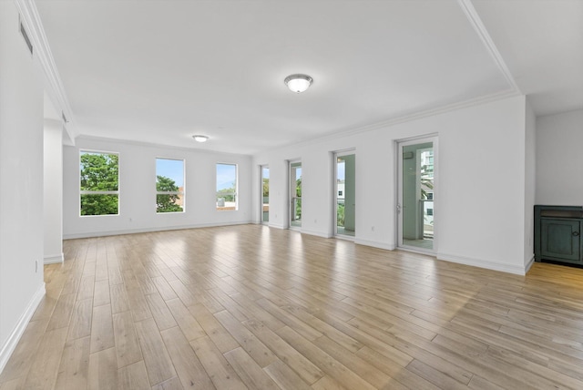455 E Palmetto Park Rd Unit 3E, Boca Raton, FL 33432 - unfurnished living room with baseboards, ornamental molding, and light wood-style floors