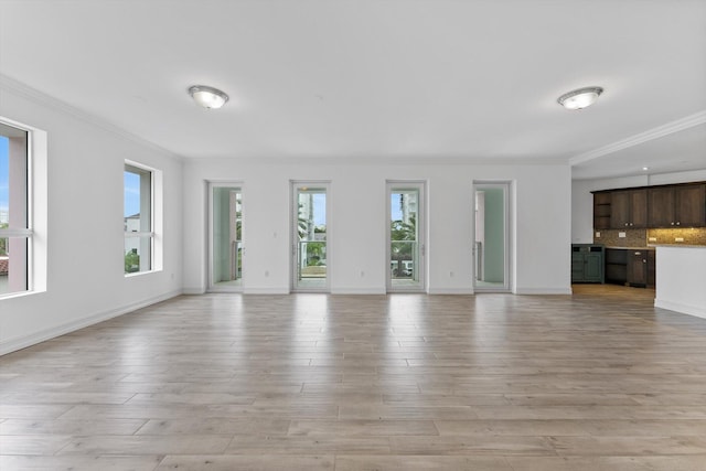 455 E Palmetto Park Rd Unit 3E, Boca Raton, FL 33432 - unfurnished living room featuring crown molding, light wood-style flooring, and baseboards