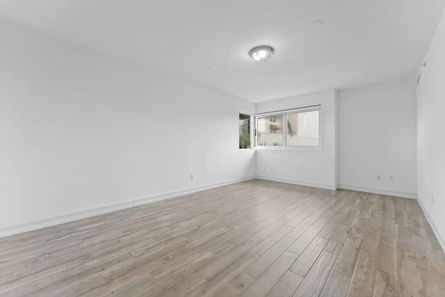 455 E Palmetto Park Rd Unit 3E, Boca Raton, FL 33432 - empty room featuring light wood-style flooring and baseboards