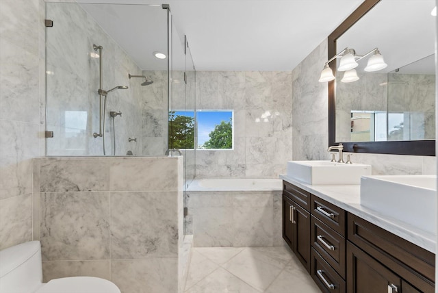 455 E Palmetto Park Rd Unit 3E, Boca Raton, FL 33432 - full bath featuring double vanity, a garden tub, tile walls, a tile shower, and toilet