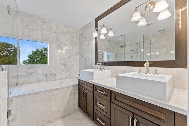 455 E Palmetto Park Rd Unit 3E, Boca Raton, FL 33432 - bathroom with a garden tub, double vanity, a marble finish shower, and tile walls