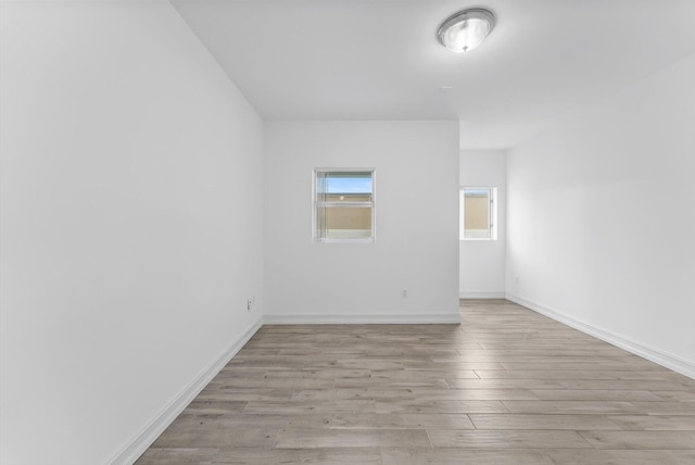 455 E Palmetto Park Rd Unit 3E, Boca Raton, FL 33432 - spare room featuring light wood-type flooring and baseboards