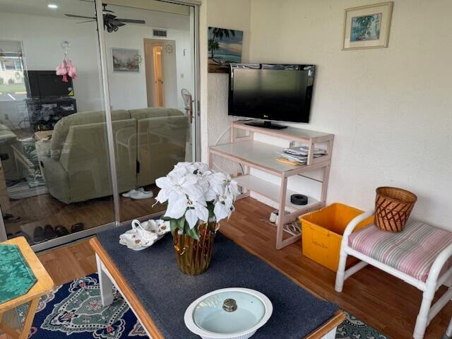 5397 Lakefront Blvd Unit A, Delray Beach, FL 33484 - living room with wood finished floors and a ceiling fan