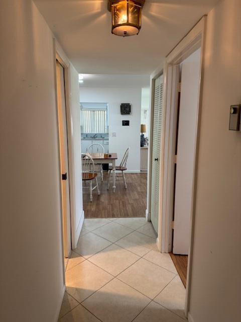 5397 Lakefront Blvd Unit A, Delray Beach, FL 33484 - hallway featuring light tile patterned floors and baseboards