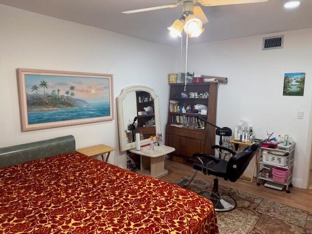 5397 Lakefront Blvd Unit A, Delray Beach, FL 33484 - bedroom featuring wood finished floors