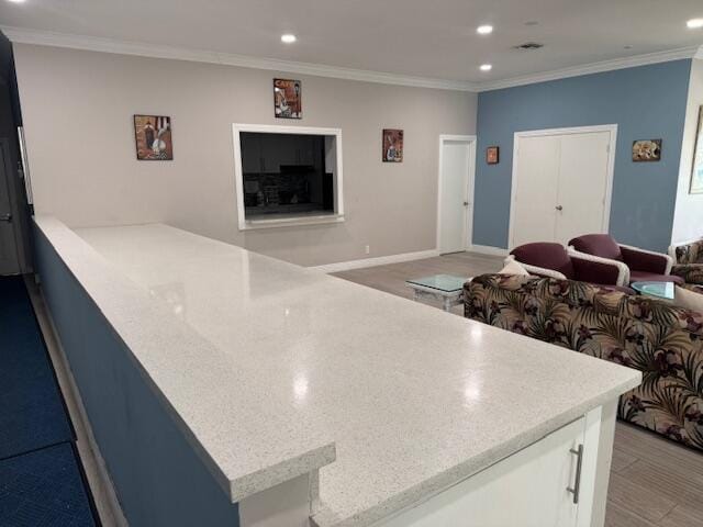 5397 Lakefront Blvd Unit A, Delray Beach, FL 33484 - kitchen featuring recessed lighting, crown molding, white cabinets, and open floor plan