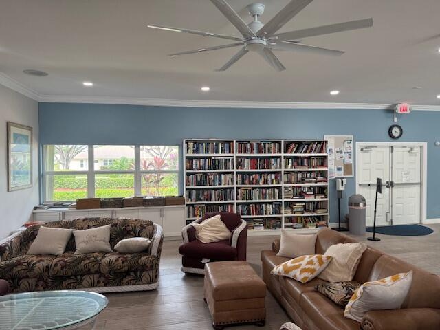 5397 Lakefront Blvd Unit A, Delray Beach, FL 33484 - living area with a ceiling fan, wood finished floors, recessed lighting, and crown molding