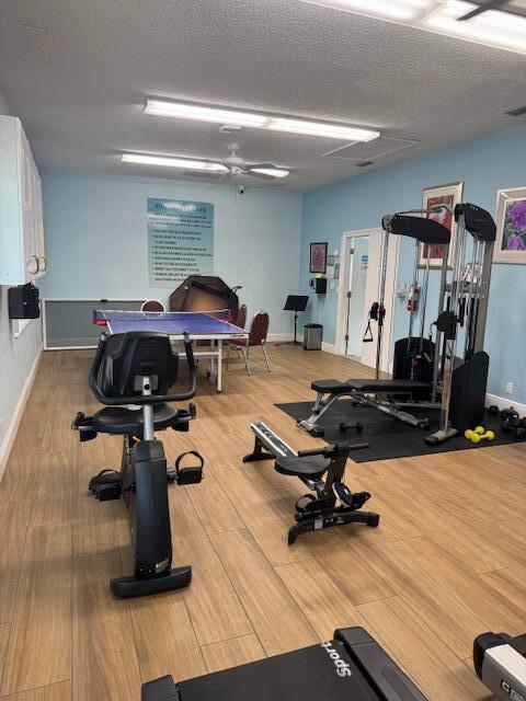 5397 Lakefront Blvd Unit A, Delray Beach, FL 33484 - exercise room featuring wood finished floors and baseboards