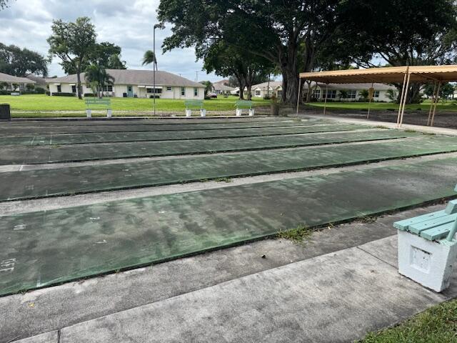 5397 Lakefront Blvd Unit A, Delray Beach, FL 33484 - view of property's community featuring shuffleboard and a lawn