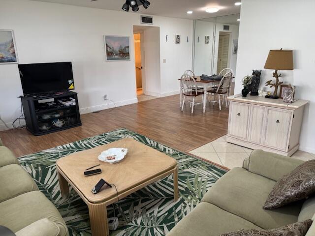 5397 Lakefront Blvd Unit A, Delray Beach, FL 33484 - living room featuring light wood-style floors, baseboards, and recessed lighting