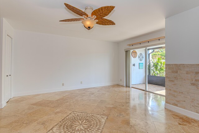 2641 Gately Dr W Unit 1003, West Palm Beach, FL 33415 - empty room with a ceiling fan and baseboards