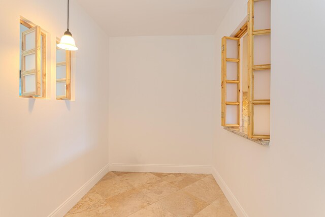2641 Gately Dr W Unit 1003, West Palm Beach, FL 33415 - empty room with baseboards