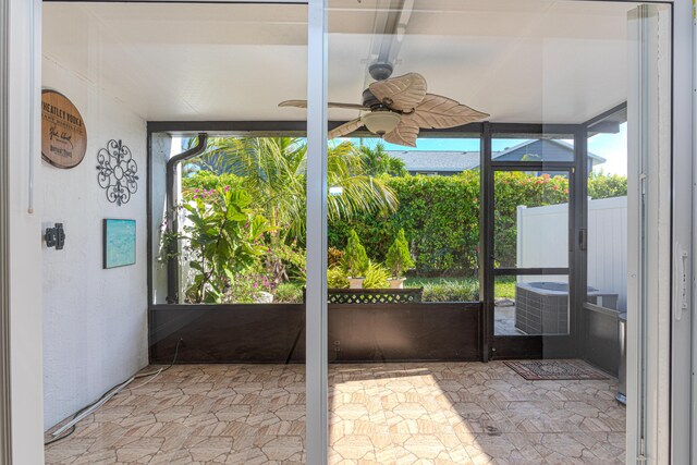 2641 Gately Dr W Unit 1003, West Palm Beach, FL 33415 - unfurnished sunroom with ceiling fan