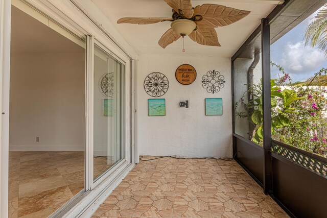 2641 Gately Dr W Unit 1003, West Palm Beach, FL 33415 - unfurnished sunroom featuring a ceiling fan
