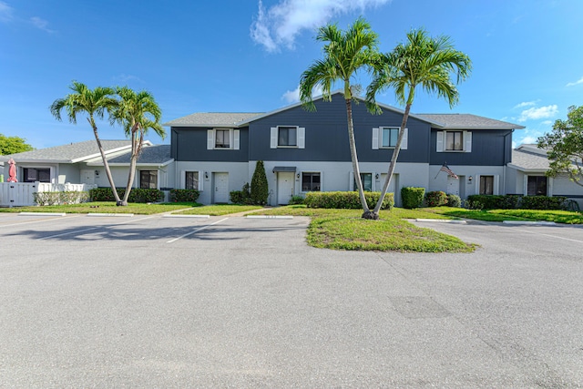 2641 Gately Dr W Unit 1003, West Palm Beach, FL 33415 - townhome / multi-family property with uncovered parking and stucco siding