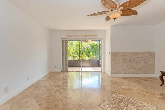 2641 Gately Dr W Unit 1003, West Palm Beach, FL 33415 - empty room with a ceiling fan and baseboards