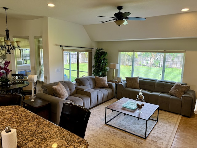 1710 SW Columbia St, Port Saint Lucie, FL 34987 - living area featuring a chandelier, plenty of natural light, lofted ceiling, ceiling fan, and recessed lighting