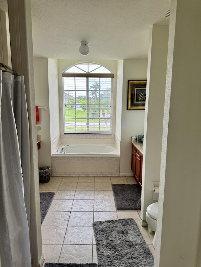 1710 SW Columbia St, Port Saint Lucie, FL 34987 - bathroom with a bath, toilet, and vanity