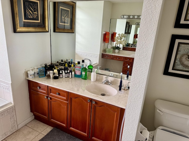 1710 SW Columbia St, Port Saint Lucie, FL 34987 - full bathroom featuring toilet, tile patterned flooring, vanity, and tiled tub