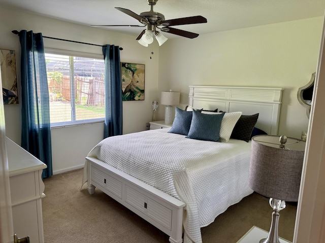 1710 SW Columbia St, Port Saint Lucie, FL 34987 - bedroom with light colored carpet, ceiling fan, and baseboards
