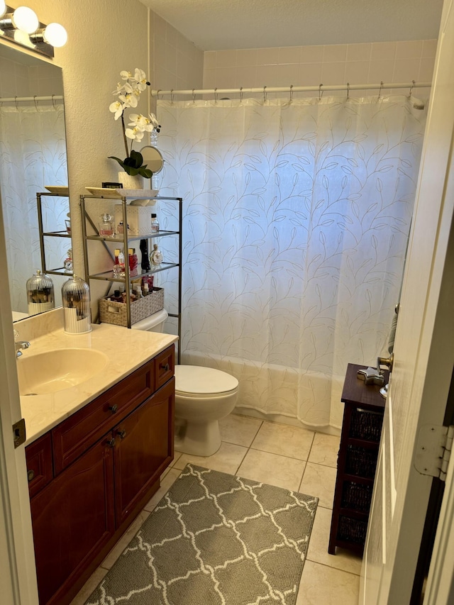 1710 SW Columbia St, Port Saint Lucie, FL 34987 - bathroom featuring vanity, toilet, and tile patterned flooring