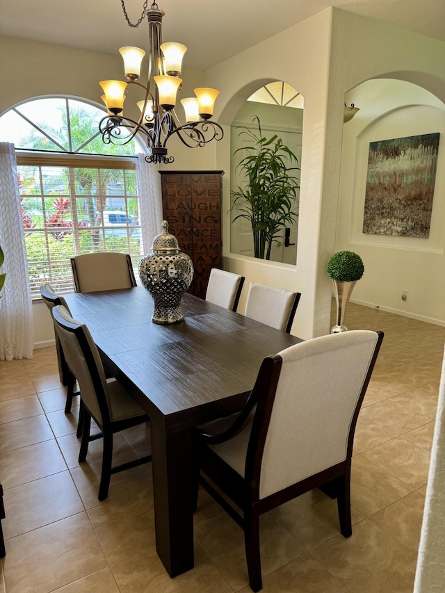 1710 SW Columbia St, Port Saint Lucie, FL 34987 - dining room featuring a chandelier and light tile patterned floors