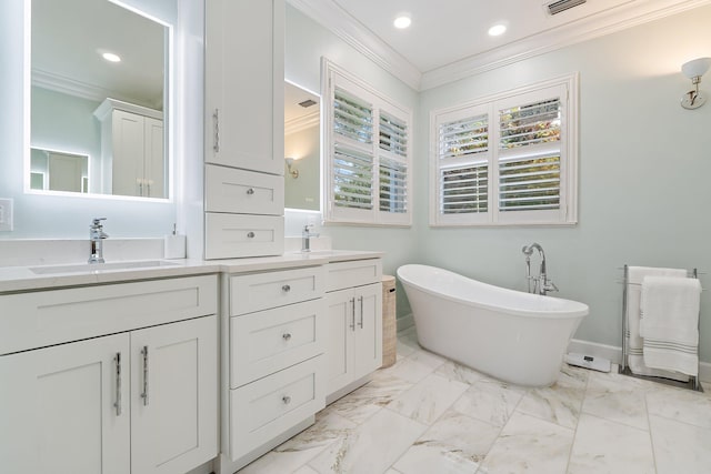 106 Henry Sewall Way, Sewalls Point, FL 34996 - full bathroom featuring ornamental molding, double vanity, a freestanding bath, recessed lighting, and marble finish flooring