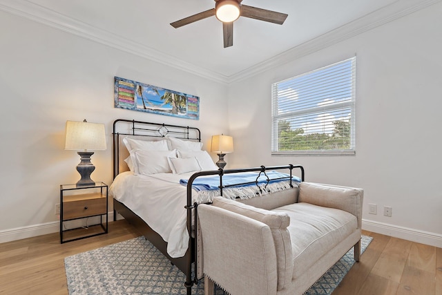 106 Henry Sewall Way, Sewalls Point, FL 34996 - bedroom featuring ornamental molding, baseboards, light wood-style flooring, and a ceiling fan