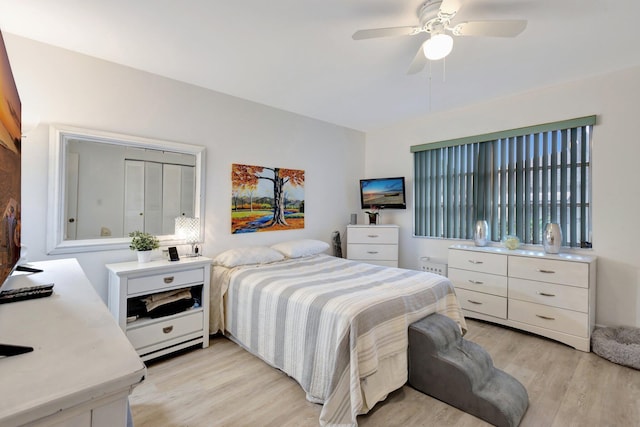 1232 W Club Dr W Unit D, Delray Beach, FL 33445 - bedroom with light wood-style flooring and a ceiling fan