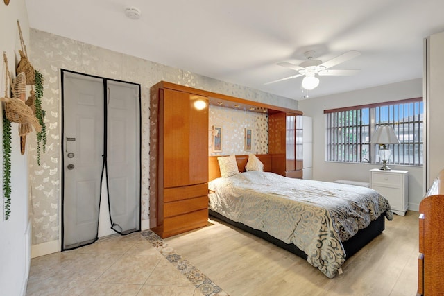 1232 W Club Dr W Unit D, Delray Beach, FL 33445 - bedroom with wallpapered walls, baseboards, and ceiling fan