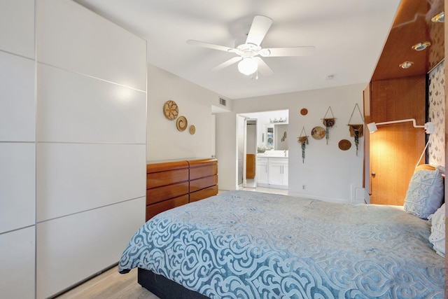1232 W Club Dr W Unit D, Delray Beach, FL 33445 - bedroom featuring a ceiling fan and connected bathroom