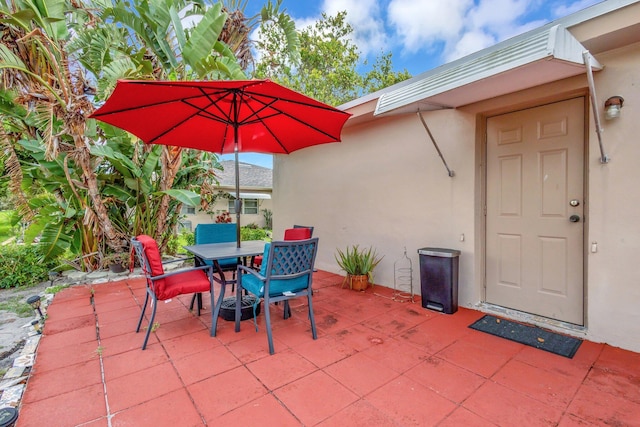 1232 W Club Dr W Unit D, Delray Beach, FL 33445 - view of patio with outdoor dining area