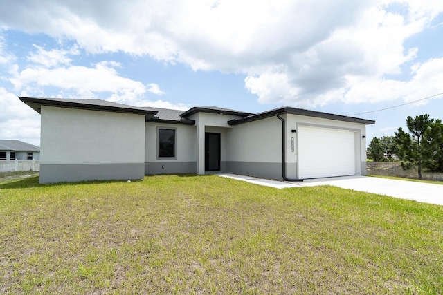 3810 29th St SW, Lehigh Acres, FL 33976 - prairie-style home with an attached garage, stucco siding, concrete driveway, and a front yard