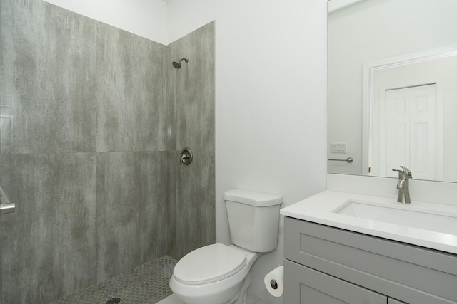 3810 29th St SW, Lehigh Acres, FL 33976 - bathroom featuring vanity, toilet, and tiled shower