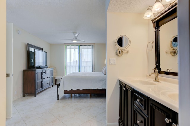 400 Ocean Trail Way Unit 707, Jupiter, FL 33477 - bedroom featuring a sink, a textured ceiling, a ceiling fan, and baseboards