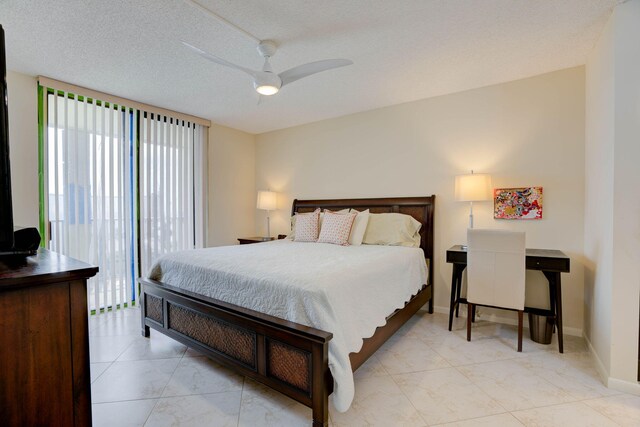 400 Ocean Trail Way Unit 707, Jupiter, FL 33477 - bedroom with a ceiling fan, baseboards, and a textured ceiling