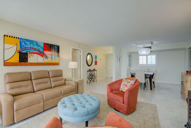 400 Ocean Trail Way Unit 707, Jupiter, FL 33477 - living area featuring light tile patterned flooring, a textured ceiling, and baseboards