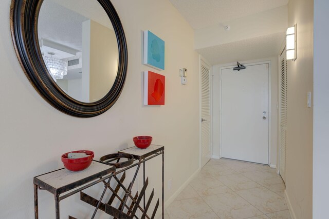 400 Ocean Trail Way Unit 707, Jupiter, FL 33477 - corridor featuring baseboards and light marble finish flooring