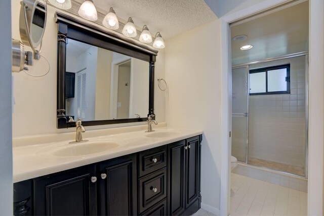 400 Ocean Trail Way Unit 707, Jupiter, FL 33477 - bathroom with double vanity, toilet, a stall shower, tile patterned floors, and recessed lighting
