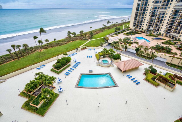 400 Ocean Trail Way Unit 707, Jupiter, FL 33477 - drone / aerial view of a pool area and waterfront with a beach