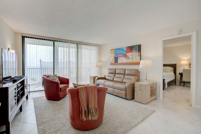400 Ocean Trail Way Unit 707, Jupiter, FL 33477 - living room featuring a textured ceiling