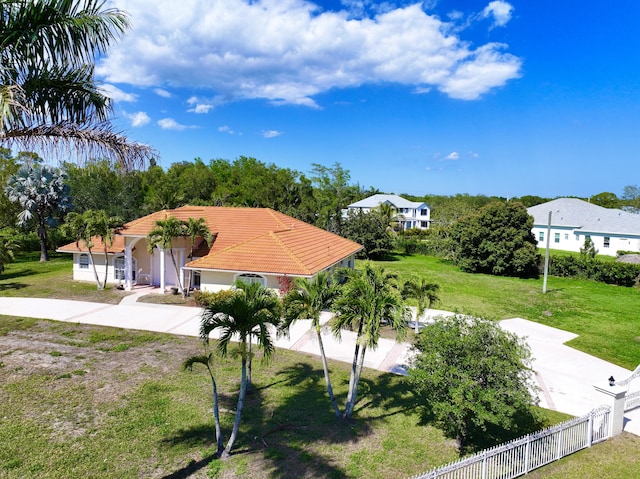 17477 69th St N, Loxahatchee, FL 33470 - view of front of home with a tile roof, concrete driveway, and stucco siding
