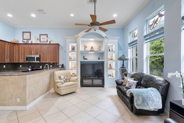 8351 Mastic Cay, West Palm Beach, FL 33411 - living room featuring a ceiling fan, light tile patterned floors, ornamental molding, and recessed lighting